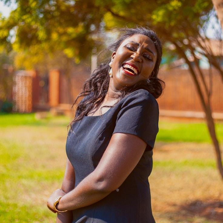 Avery Chen, Lead Design Curator at Silver Pathway Network, reviewing corporate floral arrangements
